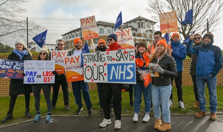 NHS strikers with placards.