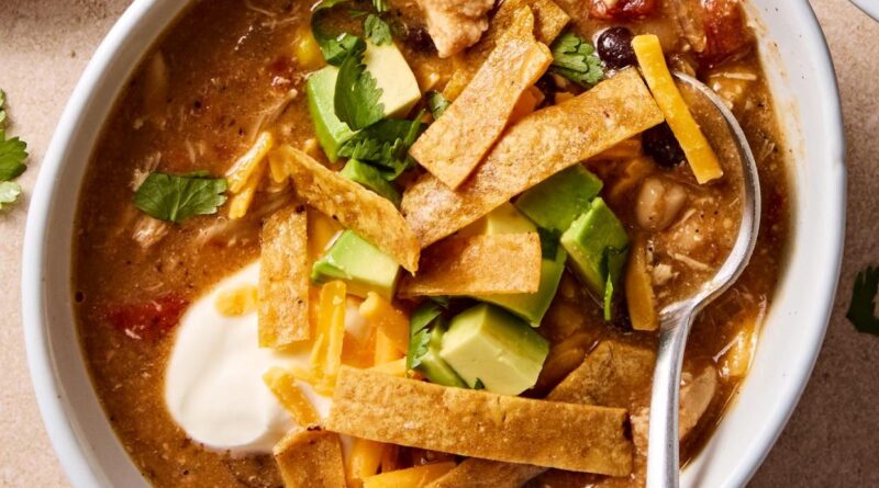 Copycat chickfila chicken tortilla soup made with tortilla strips, cilantro, avocado and sour cream.